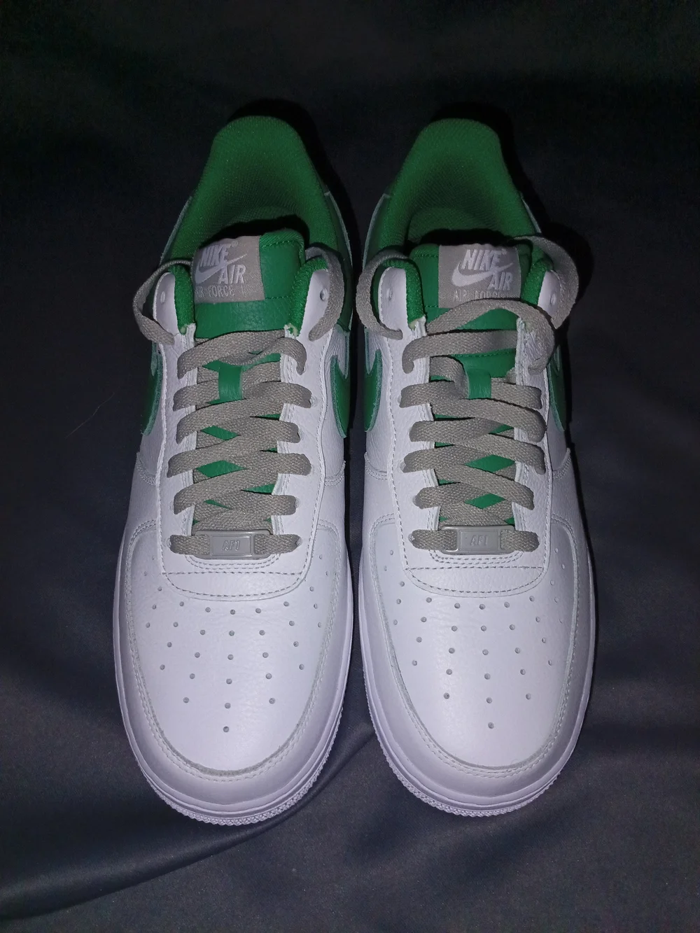 Nike White Sneakers with Green Swoosh and Heel